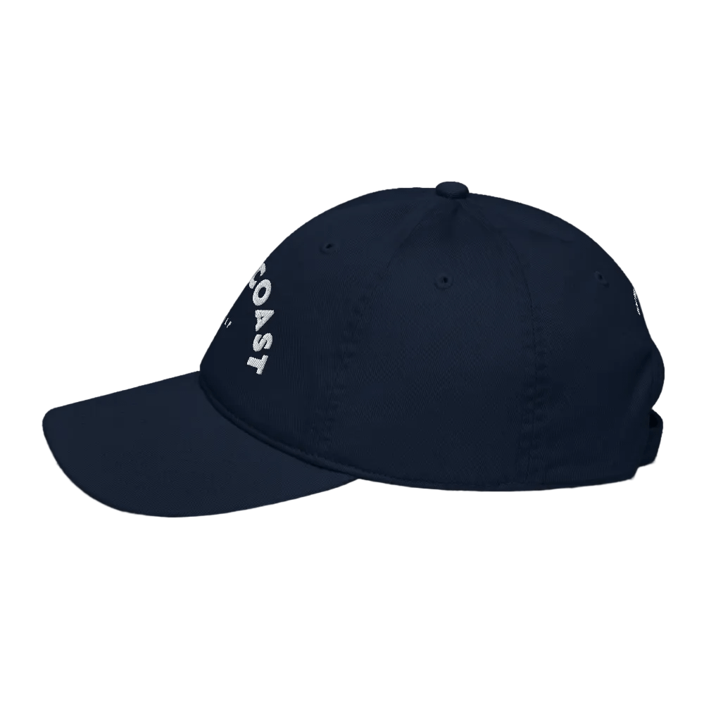 Navy blue cap with &#39;COAST&#39; logo on a black background
