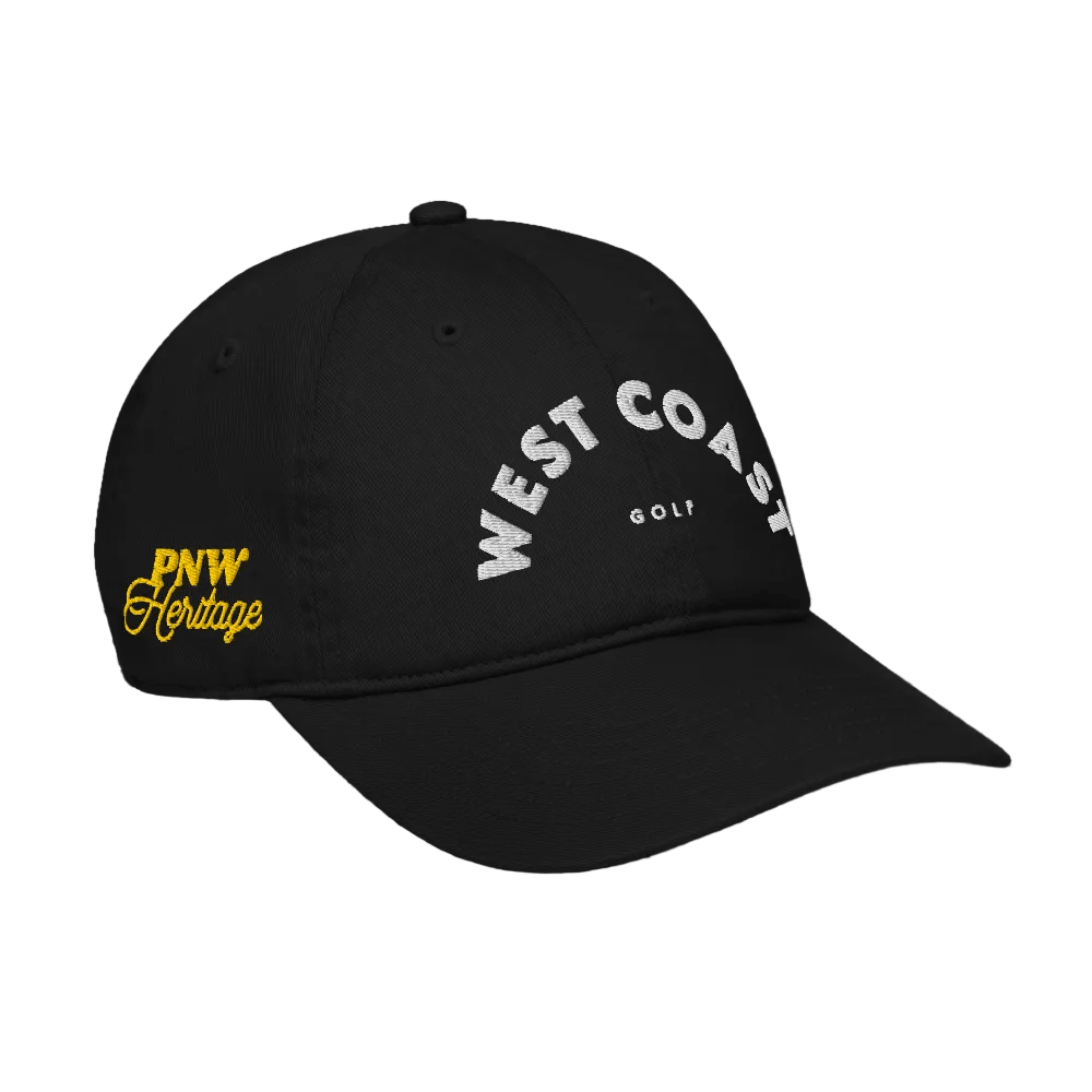 Black cap with 'West Coast Golf' and 'PNW Heritage' text on a black background