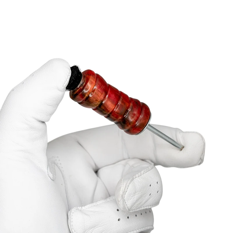 Tidy Tool Golf Divot Fixer - Alumilite Oxblood Swirl in golf glove