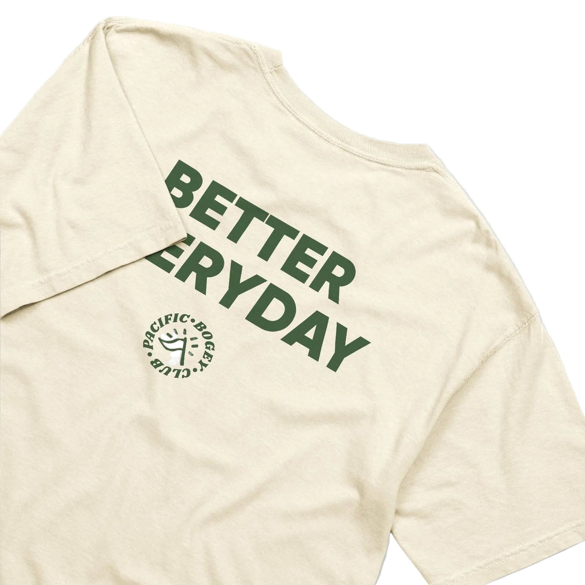 Beige t-shirt with green text &#39;Better Everyday&#39; on a light gray background