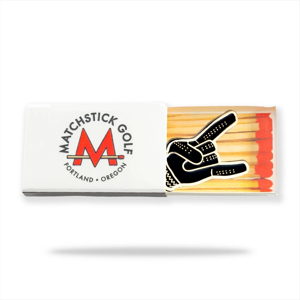 black and gold devil horns golf ball marker in matchbox packaging