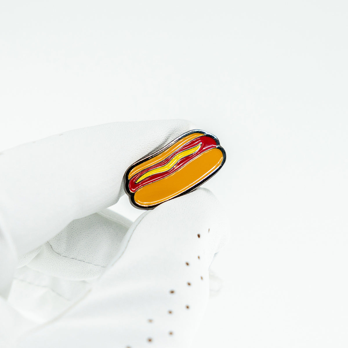 hot dog golf ball marker matchstick in white golf glove