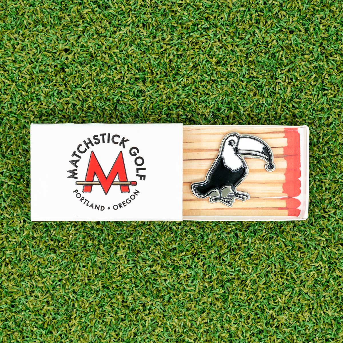 lead tape chronicles toucan golf ball marker matchbox packaging