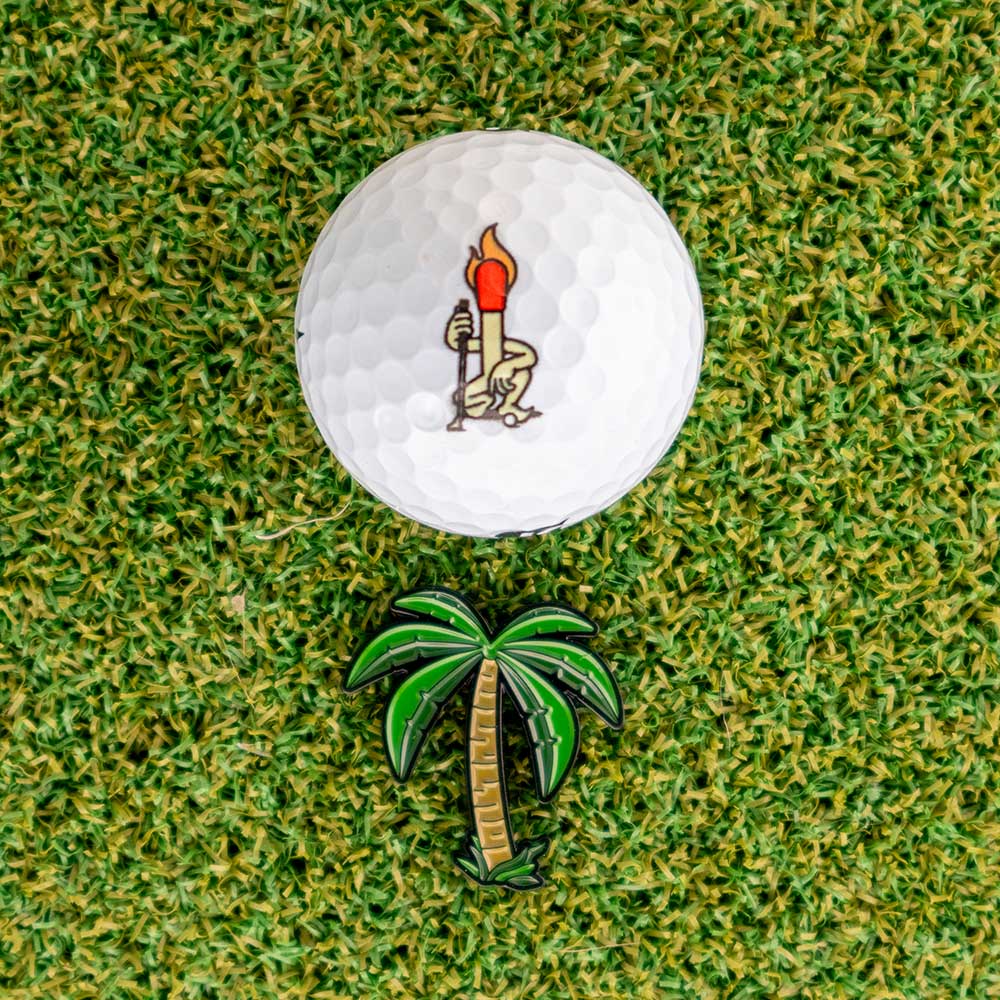 palm tree golf ball marker golf ball grass