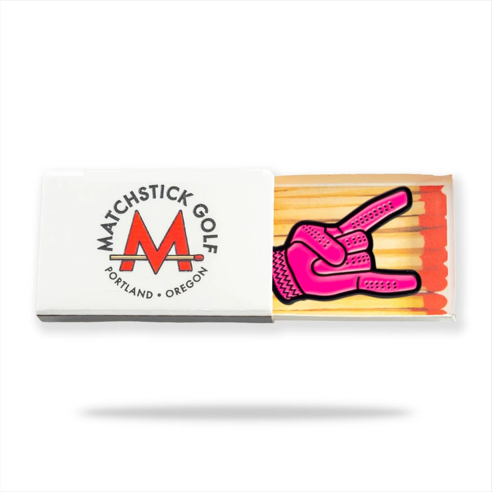 pink devil horns golf ball marker in matchbox packaging