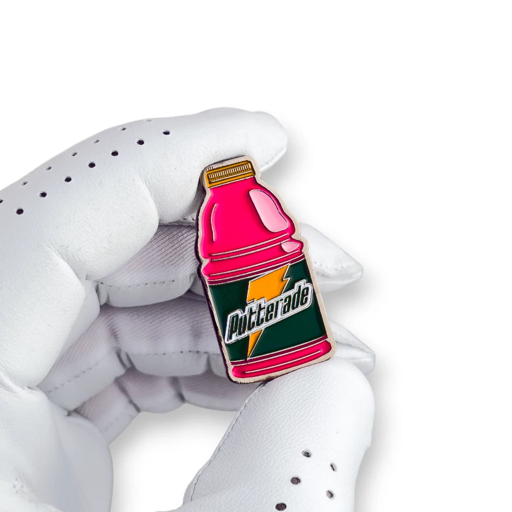 pink putterade golf ball marker white golf glove