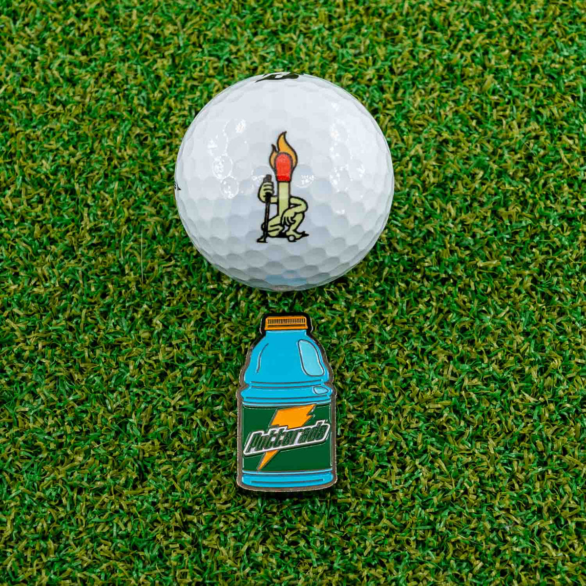 putterade golf ball marker gatorade blue frost grass with ball