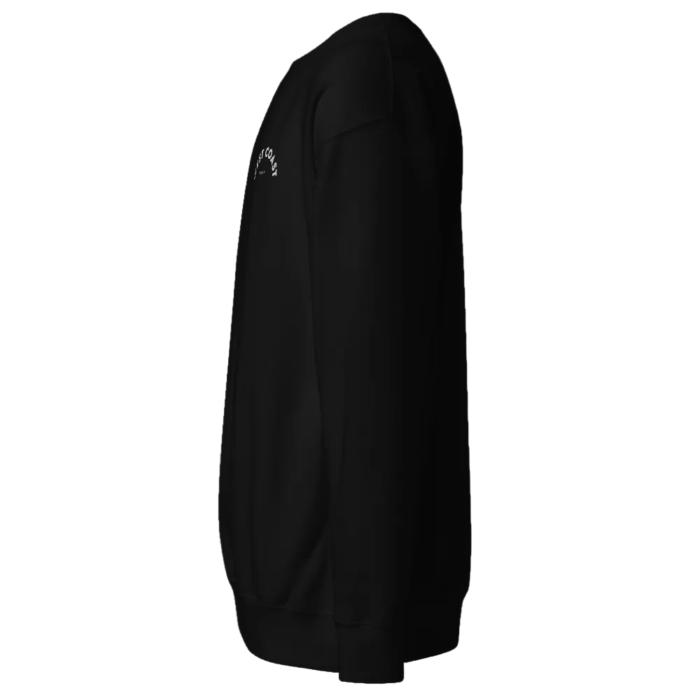Black jacket with a small white logo on the chest against a black background