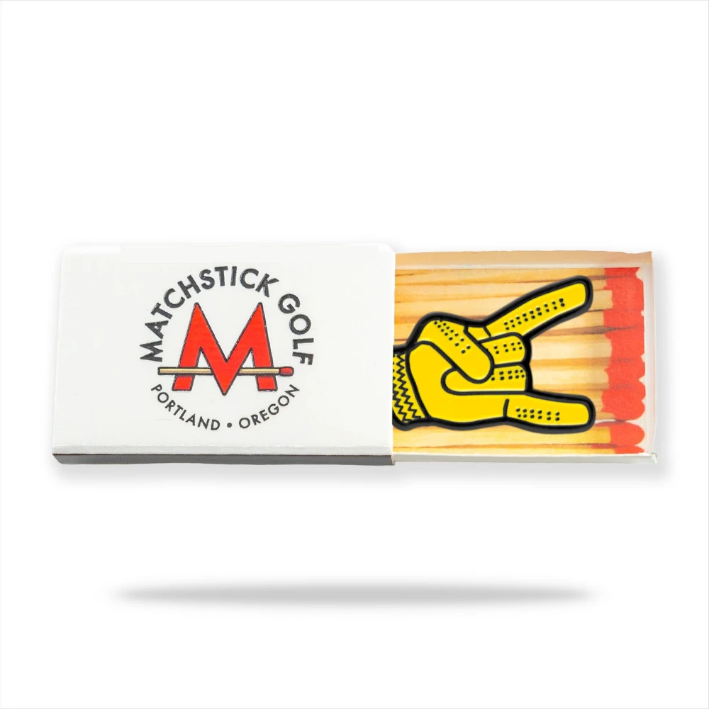 yellow devil horns golf ball marker in matchbox packaging