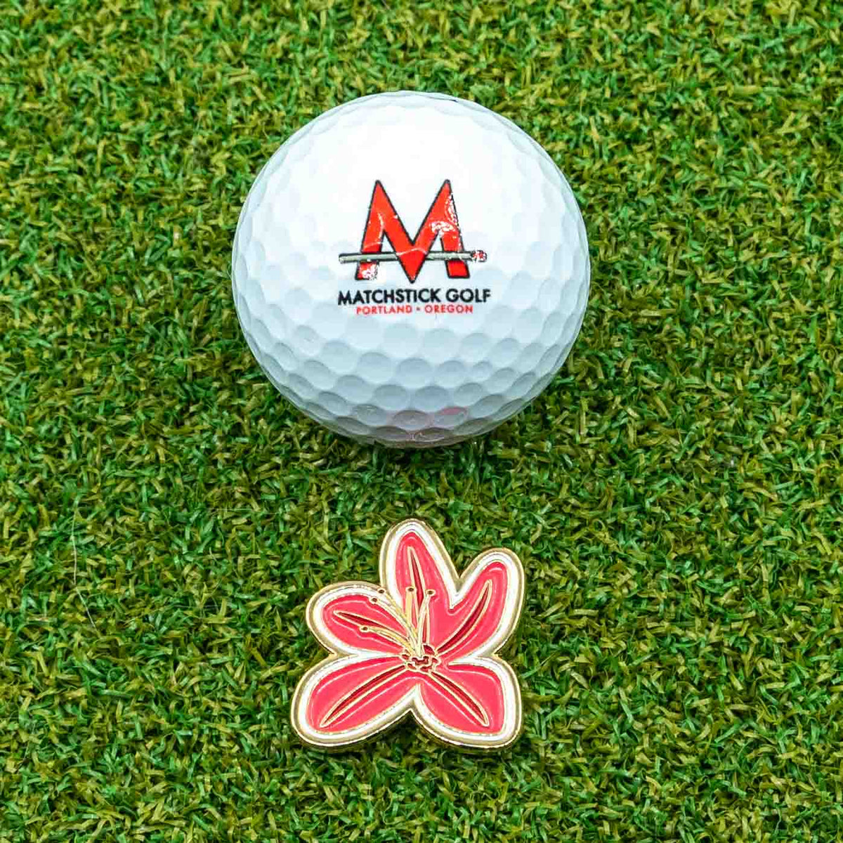 Masters Azalea Flower Golf Ball Marker with golf ball grass