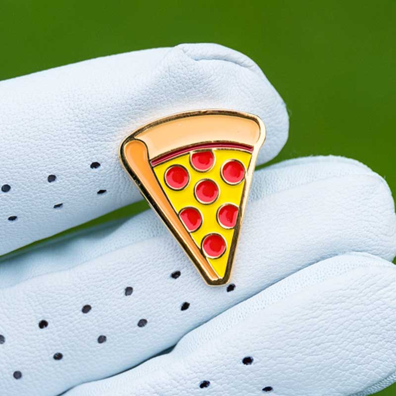 pepperoni pizza golf ball marker in golf gloved fingers