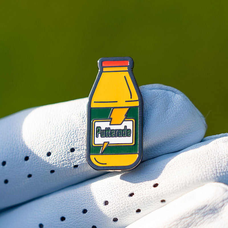 gatorade bottle golf ball marker held in golf glove
