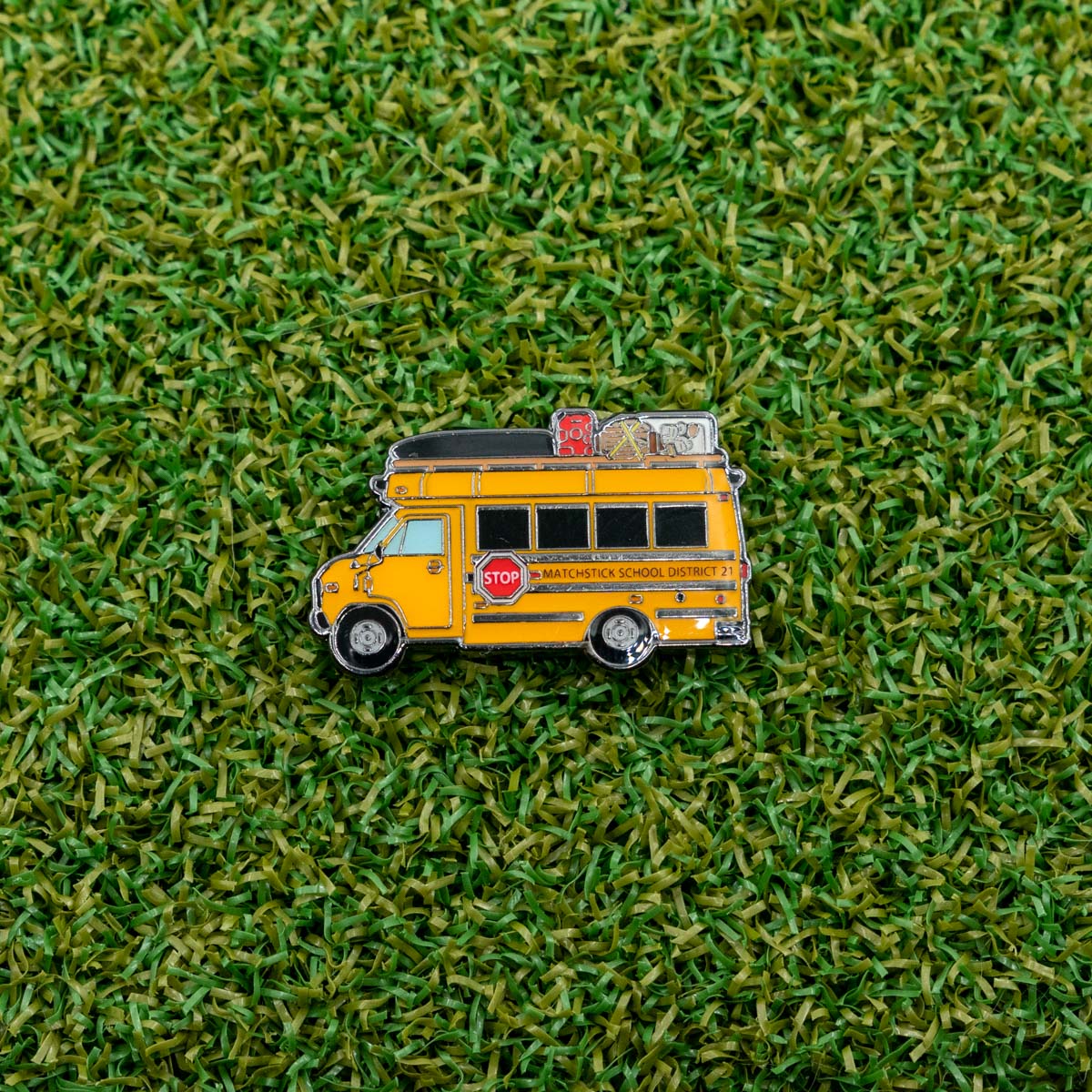 school bus golf ball marker on grass